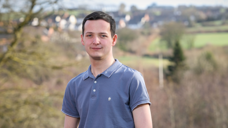 Young man standing in a field