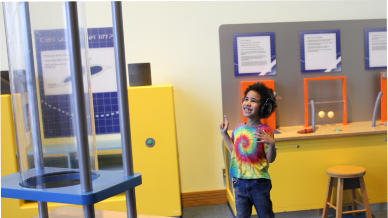Little boy standing in a playroom